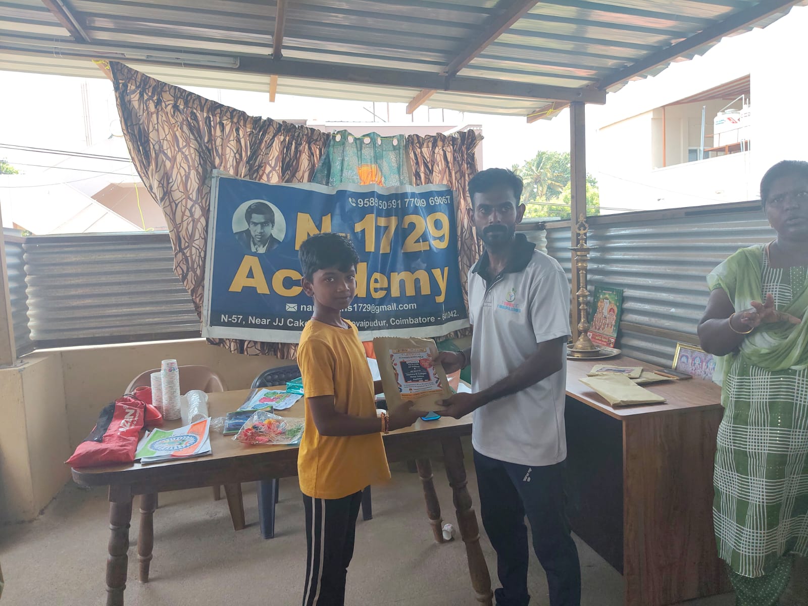 N-1729 Academy — student receiving a prize